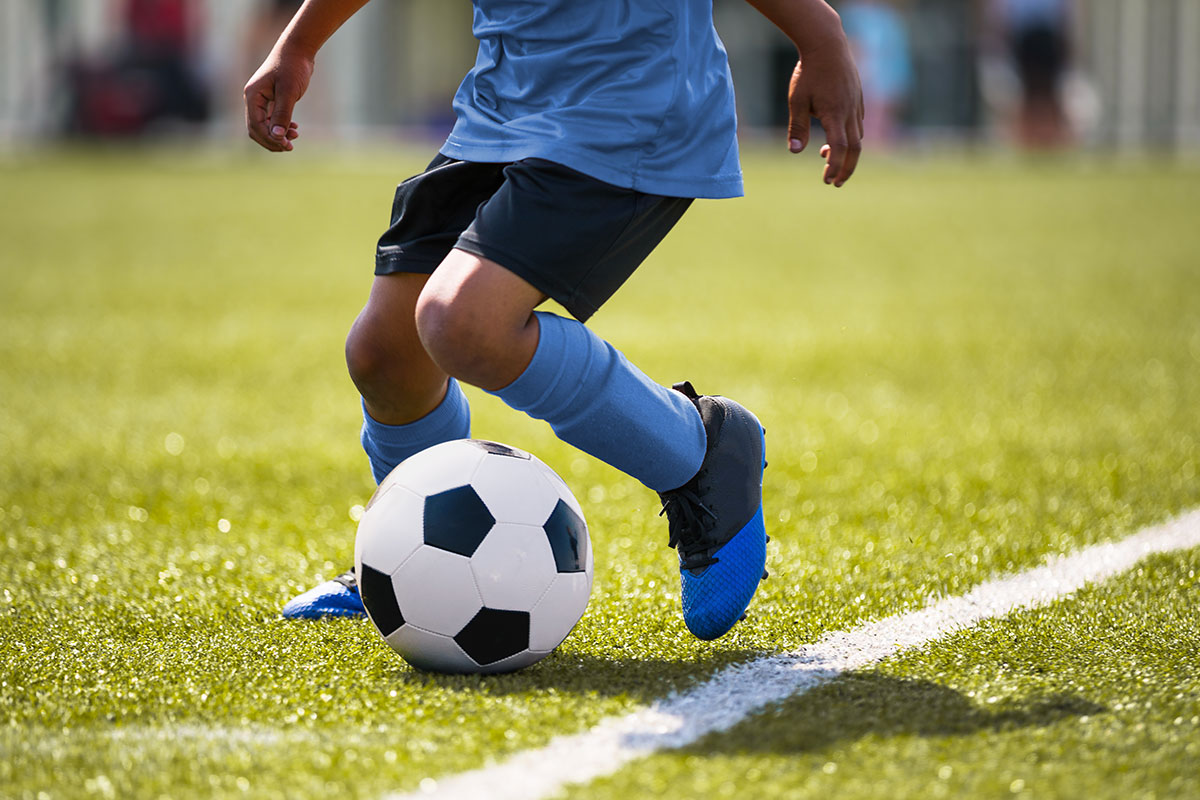 child playing soccer