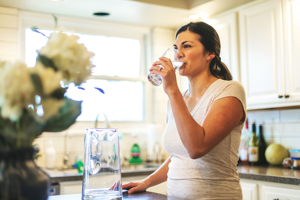 middle aged woman drinking water