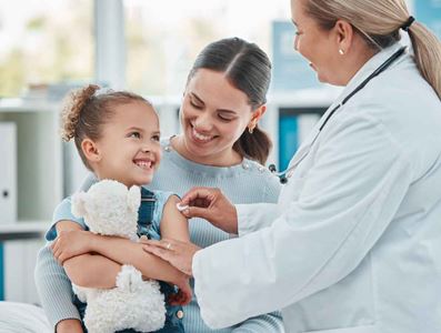 Child receives a vaccine from a doctor