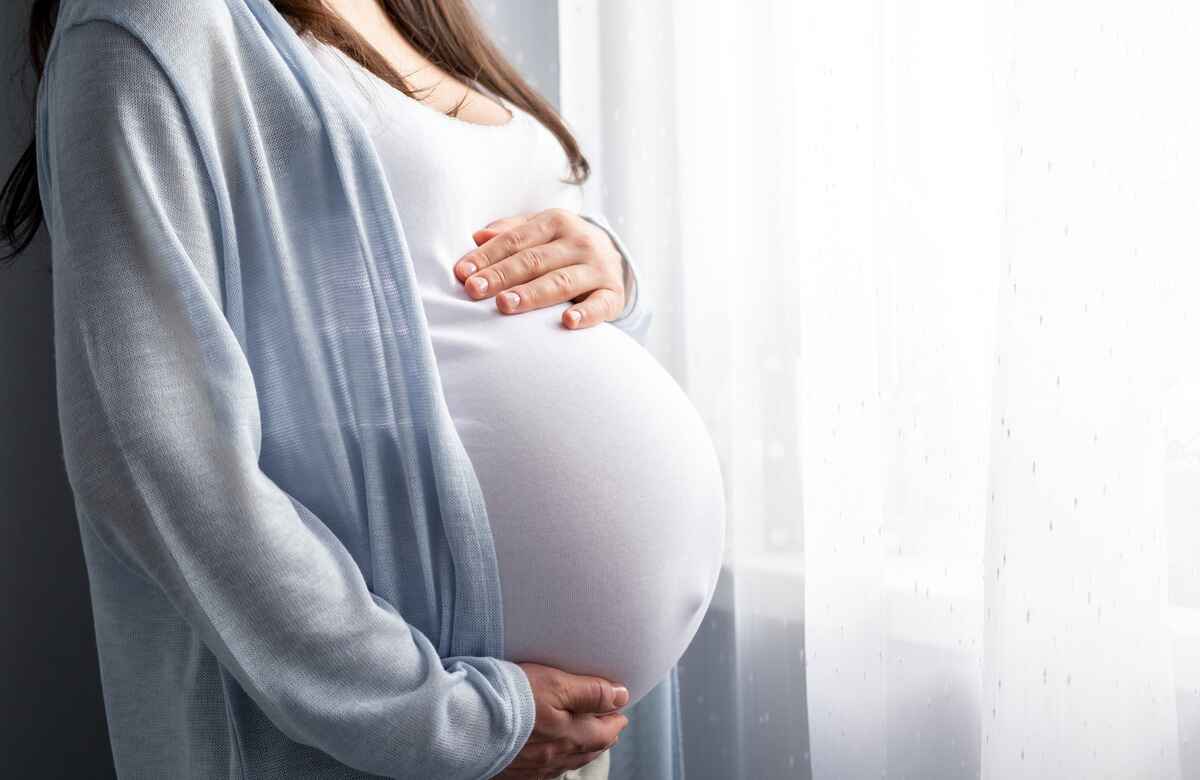 Side profile of pregnant woman