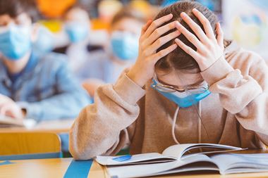 tired at school with mask