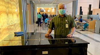 ynhh volunteer with piano