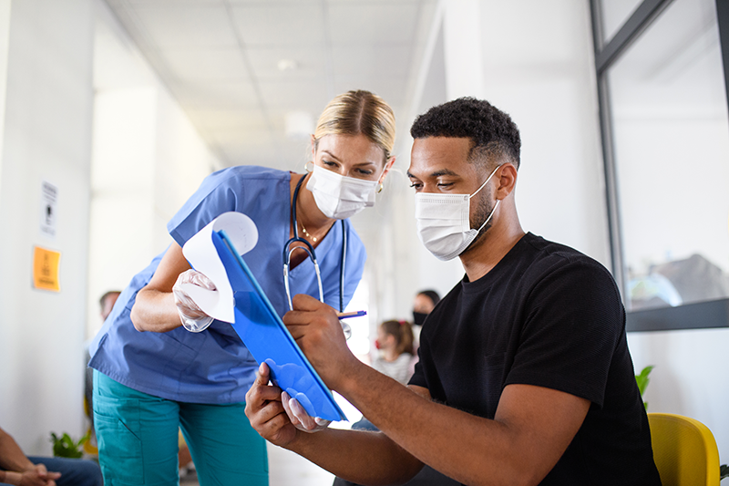 nurse and patient reviewing records