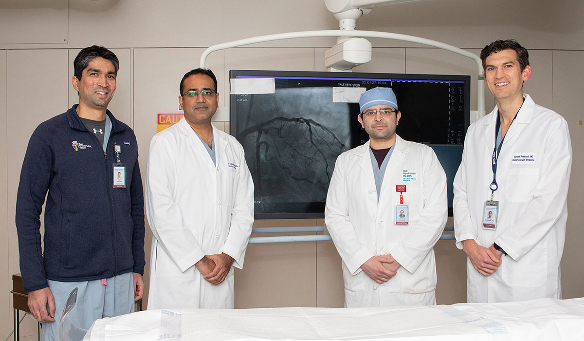 From left are Amit Vora, MD, interventional cardiologist; Prashanth Vallabhajosyula, MD, cardiac surgeon; Rahul Gupta, MD, clinical fellow; and Samuel Reinhardt, MD, cardiologist. 