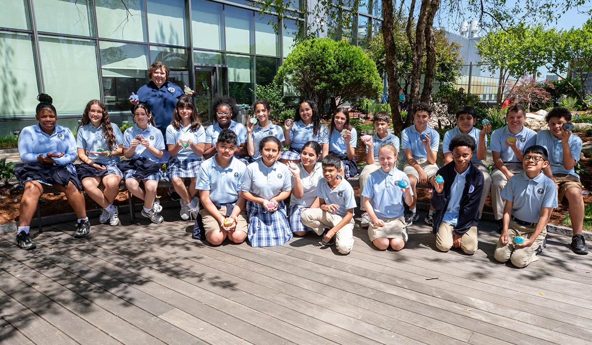 Becky Gall-Piorek and her sixth-grade students from Assumption Catholic School